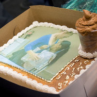 2 Girls 1 Cup Birthday cake with a picture of two girls and a decorative cup filled with brown mousse