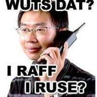 Man holding a phone to his ear and the caption WUTS DAT? I RAFF I RUSE?
