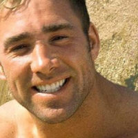 shirtless man smiling