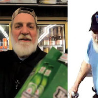 man with white beard and a black hat dressed in a blue shirt yelling