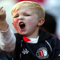 Middle Finger Kid Middle Finger Kid showing a young soccer fan named Mikey Wilson flipping off the camera at a match.