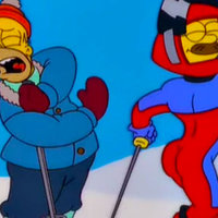 A screenshot from the simpsons episode little big mom of Flanders showing off his buttocks in a ski suit causing Homer to recoil 
