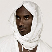 Kobe Bryant sporting a white head covering and a dead pan look on his face - image became the Kybe Bryant White Hot Cover meme