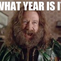 Robin Williams with an overgrown beard shouting "What year is it?"
