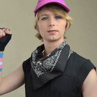 Chelsea Manning Chelsea Manning in a black bandanna and a trans flag wristband