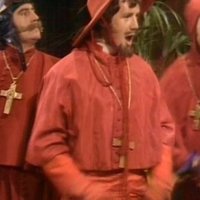 Nobody Expects The Spanish Inquisition three men in red robes wearing wooden cross around their necks