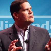 Reggie Fils-Aime Reggie Fils-Aime in front of the Nintendo logo