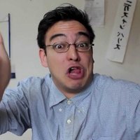 Filthy Frank George Miller in a checkered shirt making a face and gesturing at the viewer