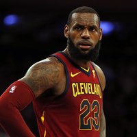 LeBron James LeBron 23 in a red Cleveland Cavaliers jersey