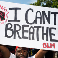man holding up a sign that reads I CAN'T BREATHE BLM along with a drawing of a black raised fist