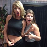 Taylor Swift Showing Her Belly Button with a classic open mouth faux shocked look