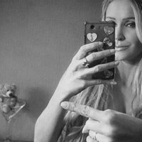 One Finger Selfie Challenge One Finger Selfie Challenge example depicting a girl taking a mirror selfie.