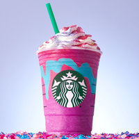 colorful Starbucks cup pink purple drink with whipped cream on top