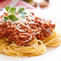 Spaghetti plate of spaghetti with tomatoes and parmesan cheese