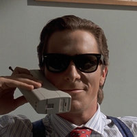 American Psycho / Patrick Bateman depicting an image from the film with Christian bale talking on the phone.