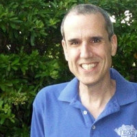 Terry Davis in a blue polo shirt smiling