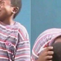 African Kid Crying With A Knife