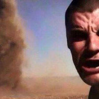 Tornado Selfie / Here It Comes man with his mouth open and squinting at the camera in front of a digitally created tornado.
