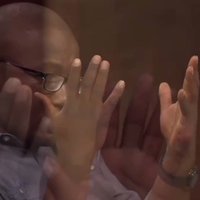 Hannibal Buress Looking at His Hands