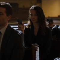 Assassination Chain Three people pointing guns at each other while sitting in pews in a church