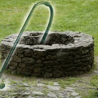 stone well with a vacuum cleaner coming out of it
