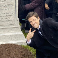 Grant Gustin Next To Oliver Queen's Grave flash actor grant gustin standing over the grave of oliver queen from the dc comics television series arrow