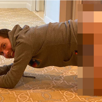 ryland adams crouching on the floor pantsless