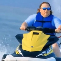 james garretson on a jetski wearing sunglasses 
