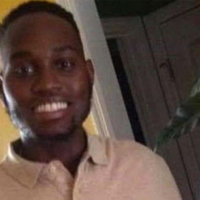 ahmaud arbery in a pink shirt