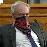 senator tim kaine in a bandana in a Senate Health Committee hearing