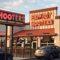 Femboy Hooters Femboy Hooters location next to the original Hooters sign