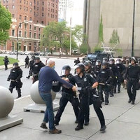 video in which buffalo police shove elderly man to the ground and he bleeds as officers walk by