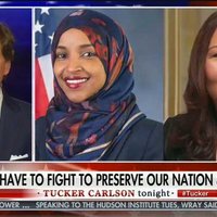 Tucker Carlson's "We Have to Fight to Preserve Our Nation & Heritage" 14 Words Chyron tucker carlson chyron that reads "we have to fight to preserve our nation & heritage" featuring ilhan omar and tammy duckworth