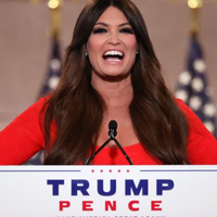 Kim Guilfoyle on a podium at a Trump Pence convention