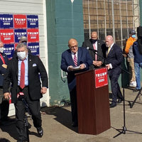 Four Seasons Total Landscaping Press Conference Trump team preparing for speech at a parking lot