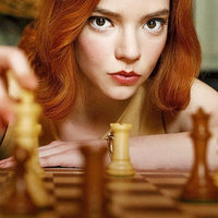 The Queen's Gambit Anya Taylor-Joy as Beth Harmon holding a chess piece