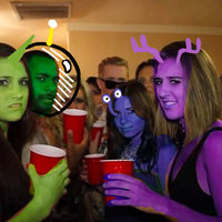 The Galactic Federation People at a party made up to look like space aliens to represent the galactic federation