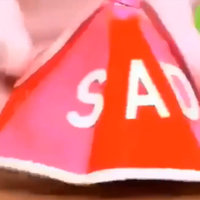 red hat with the word SAD written on it
