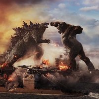 Godzilla vs. Kong Godzilla and King Kong fighting on top of battleships