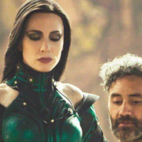 Cate Blanchett in costume on the set of Thor Ragnarok towering above director Taika Waititi