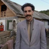 This Is My Neighbor meme depicting Borat in a village.