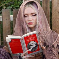 Grimes Reading The Communist Manifesto Image of Grimes Reading The Communist Manifesto and meme template.