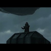 Dune Sardaukur chant scene depicting a dark figure chanting on top of a pedestal above a crowd of soldiers.