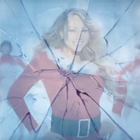 Mariah Carey Defrosting meme depicting an image of the singer wearing Christmas garb breaking through ice.