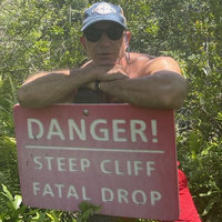 Jeff Bezos "Steep Cliff Fatal Drop" Warning Jeff Bezos Steep Cliff Fatal Drop Warning meme format and template depicting the Amazon CEO leaning on a Danger sign.
