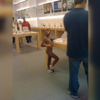 Gay Little Monkey Boy At Apple Store meme template and format depicting a kid at an apple store posing on a table with his leg up.