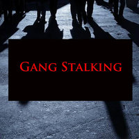 Gangstalking / Gangstalkers Gang Stalking conspiracy theory depicting a dark street with looming shadows.