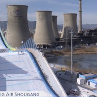 Big Air Shougang depicting cooling towers from a nearby power plant during the 2022 Beijing winter olympics.