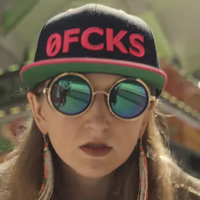 Razzlekhan Heather Morgan depicting one of the suspects in the Bitfinex hack wearing sunglasses and a hat that reads "zero fcks."