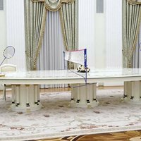 Putin's Long Table An image of president vladimir putin sitting at a large table with macron photoshopped to make them play badmitton.